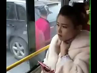 Chinese girl kissed. Far bus .